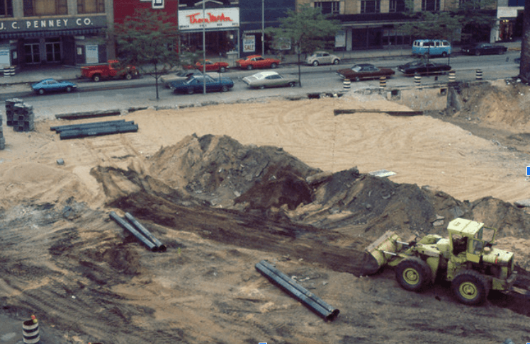 A picture of a work zone being bulldozed. This picture is older, displaying construction of an earlier time.