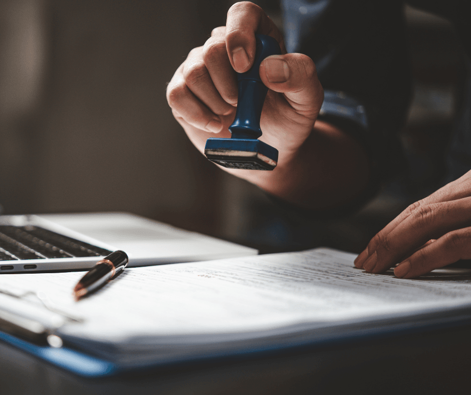 A person approving the permit with a stamper of approval. This would likely be your local administration.